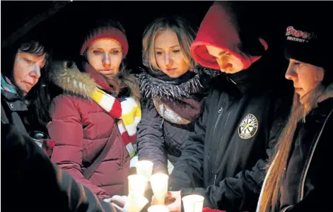  ?? ALISON LANGLEY/NIAGARA FALLS REVIEW ?? Linda Carter, Heather Strohak, Amanda Flasko, Daniel Krowchuk and Sarah Krowchuk were among more than 200 people who attended a candleligh­t memorial for Jessica Edwards, Sunday. The young Niagara Falls woman was killed as a result of a crash Feb. 24...