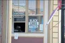  ?? JON WINKLER / NVV ?? A Black Lives Matter sign in the window of the Union Coffee Roaster shop in Ayer.