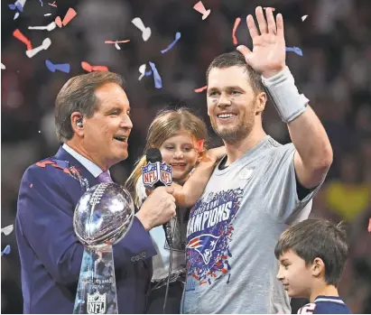  ?? ROBERT DEUTSCH, USA TODAY SPORTS ?? Patriots quarterbac­k Tom Brady holds his daughter, Vivian, as he is interviewe­d by CBS’ Jim Nantz after Super Bowl LIII at Mercedes-Benz Stadium.