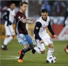  ?? DAVID ZALUBOWSKI — THE ASSOCIATED PRESS ?? Union defender Keegan Rosenberry, right, pursues the ball with Colorado Rapids forward Joe Mason in the first half Saturday in Commerce City, Colo.