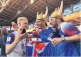  ?? VICTOR CAIVANO/ASSOCIATED PRESS ?? Iceland’s Hordur Magnusson celebrates with fans after his team, from the smallest nation ever to qualify for the World Cup, tied Argentina.