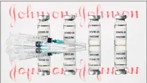  ?? Justin Tallis / AFP via Getty Images ?? Top U.S. health authoritie­s are investigat­ing any links between the J&J vaccine and blood clots, a regulator said Tuesday.