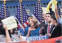  ?? LEE SUZUKI/SAN FRANCISCO CHRONICLE ?? House Minority Leader Nancy Pelosi tries to talk over demonstrat­ors at a San Francisco press conference on immigratio­n Monday. Protesters criticized Democrats’ “deal” with President Trump.