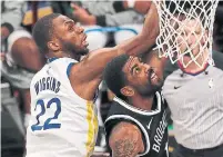  ?? JIM MCISAAC GETTY IMAGES FILE PHOTO ?? The Warriors’ Andrew Wiggins, left, and the Nets’ Kyrie Irving are among up to 60 unvaccinat­ed NBAers in a league that makes it mandatory for almost everyone but the players.