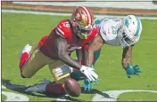  ?? JOSE CARLOS FAJARDO — BAY AREA NEWS GROUP ?? San Francisco 49ers’ Deebo Samuel (19) drops a pass while being guarded by Miami Dolphins’ Xavien Howard (25) in the second quarter of their game at the Levi’s Stadium in Santa Clara, on Oct. 11.