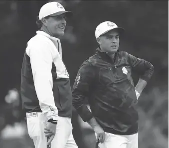  ?? SAM GREENWOOD/GETTY IMAGES ?? Phil Mickelson, left, and Rickie Fowler of the United States look on during practice prior to the 2016 Ryder Cup at Hazeltine National Golf Club on Wednesday in Chaska, Minn.