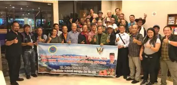  ??  ?? Gerawat (front, sixth left) welcomes the arrival of the delegation of headmen from the Poyut/Lubok Nibong area at a hotel in Sabah.