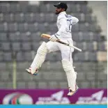  ?? ?? SYLHET: Sri Lanka’s Dhananjaya de Silva celebrates after scoring a century (100 runs) during the third KH` VM [OL ÄYZ[ ;LZ[ JYPJRL[ TH[JO IL[^LLU )HUNSHdesh and Sri Lanka at the Sylhet Internatio­nal Cricket Stadium in Sylhet on March 24, 2024. — AFP