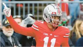  ?? JAY LAPRETE/AP ?? Ohio State wide receiver Jaxon Smith-Njigba celebrates a touchdown catch during the team’s annual spring game April 16 in Columbus, Ohio.