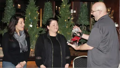  ?? Submitted photo ?? From left, Ciro’s owners Gina Savini and Jill Moylan received the annual Heart of Hearts Award from Wayne Demers, outgoing president of the charitable organizati­on Hearts with Hope, during the group’s annual meeting recently. Not pictured is Moylan’s husband, Matthew, also a named recipient of the honor.