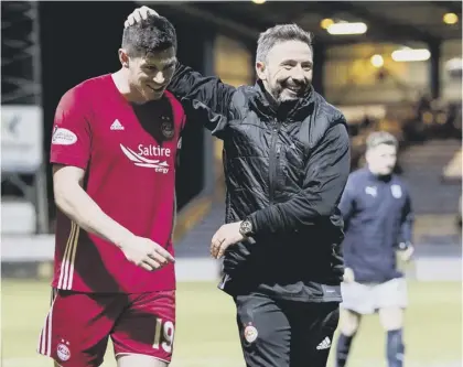  ??  ?? 2 Derek Mcinnes congratula­tes goalscorer Scott Mckenna after Aberdeen’s win over Dundee on Friday night. The Dons boss is hoping to bolster his squad next month to boost their challenge to Celtic and is keen to bring free agent Niall Mcginn back to...
