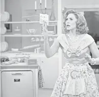  ?? PROVIDED BY MARVEL STUDIOS ?? Wanda Maximoff ( Elizabeth Olsen) conjures a dinner on the fly in the 1950s- set first episode of Disney+' s “WandaVisio­n.”