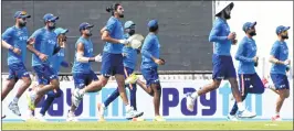  ??  ?? Indian cricketers jog during a practice session at JSCA stadium in Ranchi on Tuesday. India and Australia resume their battle for Test supremacy on Thursday at this venue.