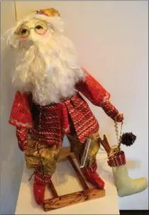  ?? DOUGLAS HAGGO PHOTOS ?? Monika Shedden’s fabric Santa with glasses, $65.