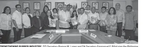  ??  ?? STRENGTHEN­ING RUBBER INDUSTRY. DTI Secretary Ramon M. Lopez and DA Secretary Emmanuel F. Piñol sign the Philippine Rubber Industry Roadmap 2017-2022 in the presence of (from left) PCAF Executive Dircetor Sarah Gutierrez-Cayona; DTI Undersecre­tary Rowel...