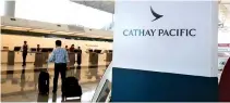  ?? REUTERS ?? A PASSENGER WALKS to the First Class counter of Cathay Pacific Airways at Hong Kong Airport in Hong Kong, China, April 4.