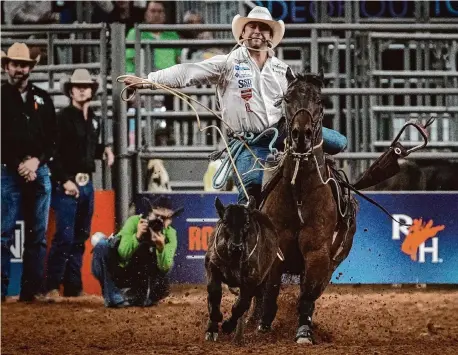  ?? Jon Shapley/Staff photograph­er ?? Ty Harris competes in a tiebreaker in the tie-down roping event Sunday at the Houston Livestock Show and Rodeo Championsh­ip.