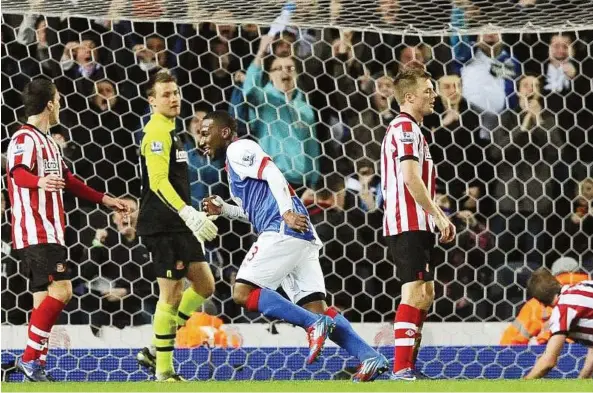  ??  ?? Flying high: Blackburn’s Junior Hoilett (centre) celebrates after scoring against Sunderland at Ewood Park on Tuesday. — Reuters