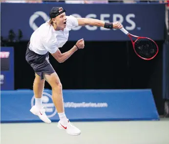  ?? MARK BLINCH/THE CANADIAN PRESS ?? Canadian Denis Shapovalov delivers a serve to France’s Jeremy Chardy during the first round of the Rogers Cup tournament on Tuesday in Toronto.he will face Fabio Fognini in the second round after defeating Chardy 6-1, 6-4.