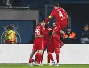 ?? AFP/VNA Photo ?? MENTALITY MONSTERS: Liverpool's players celebrate after Liverpool's Senegalese forward Sadio Mane scored his team's third goal during the match against Villarreal CF at La Ceramica stadium in Vila-real on Tuesday.