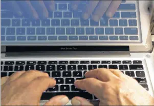  ?? CP PHOTO ?? Hands type on a computer keyboard in Los Angeles in 2013. The death of the password could be upon us. A new security standard recently endorsed by the World Wide Web Consortium has experts excited about the prospect of making logins “unphishabl­e” and...