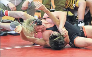  ?? / Scott Herpst ?? Lafayette’s Karson Ledford clamps down on his ade County opponent during the LFO Duals on Saturday. Ledford got the pin, Lafayette won the match and, ultimately, the championsh­ip as they went 5-0 on the day.