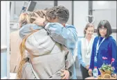  ?? The Associated Press ?? A photo provided by Israel’s Government Press Office on Friday shows Israeli hostage Mia Shem reuniting with her family at Sheba Medical Center. She was released on Thursday. Israel said that 136 hostages remain in Gaza.