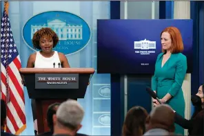  ?? (AP/Evan Vucci) ?? White House press secretary Jen Psaki (right) listens as incoming press secretary Karine Jean-Pierre speaks Thursday during a press briefing at the White House in Washington.
