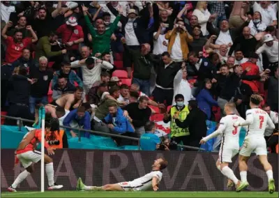  ?? (AP/Frank Augstein) ?? England’s Harry Kane (center) celebrates Thursday after scoring his side’s second goal during the championsh­ip round.