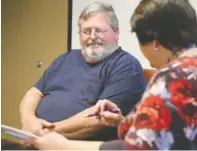  ?? STAFF PHOTO BY ERIN O. SMITH ?? William Potts, left, speaks with Karen Crowder, a population health coach and registered nurse, about foods he can and cannot eat during March 19 appointmen­t at CHI Memorial Family Practice Associates in Ooltewah.