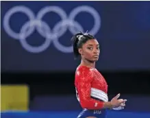  ?? AP PHOTO/ GREGORY BULL ?? American gymnast Simone Biles waits to perform on the vault during the women’s gymnastics team final Tuesday at the Tokyo Olympics. Biles wound up withdrawin­g from that competitio­n after a troublesom­e vault, and she decided Wednesday to exit from Thursday’s allaround individual final as well.