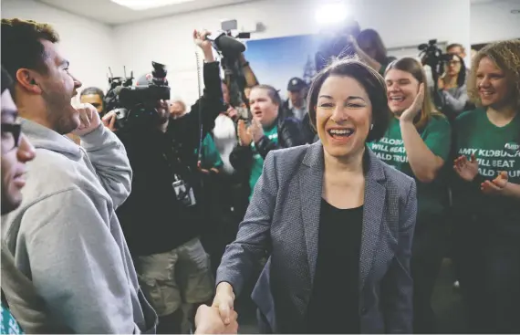  ?? PATRICK FALLON/ REUTERS ?? U.S. Democratic presidenti­al candidate Senator Amy Klobuchar, greeting supporters and volunteers in Las Vegas, Nevada, on Saturday, has spent more than a decade
as co-chair of the Canada-u.s. Inter-parliament­ary Group and understand­s Canada’s trade priorities.