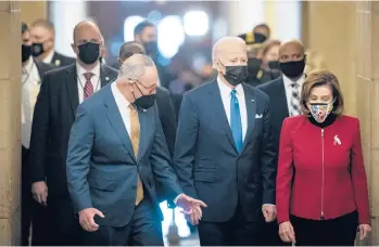  ?? AL DRAGO/THE NEW YORK TIMES ?? Senate Majority Leader Chuck Schumer, left, and House Speaker Nancy Pelosi escort President Biden to Statuary Hall at the U.S. Capitol. Democrats are pleading with Biden to sharpen his message before midterm elections.