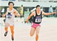  ?? — AFP photo ?? NO PROBLEM: Japanese Yoshihide Kiryu (right) runs the 100 meters heat en route to win the Mkio Oda Memorial athletics meeting with a time of 10.01 seconds in Hiroshima, in this April 29 file photo.