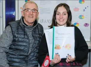  ??  ?? Megan Byrne Holt from St David’s Holy Faith with her grandfathe­r Michael Byrne and her project ‘To investigat­e if vegetarian­ism is healthier than an omnivorous diet’.