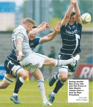  ?? PICTURE: Getty Images ?? Seeing double: Ben Curry, left, and Tom Curry of Sale Sharks charge down a kick by Rhys Priestland