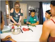  ?? Marcus Yam Los Angeles Times ?? ELMIRA AVETIAN teaches Georgian cuisine during a home cooking class this summer in Glendale.