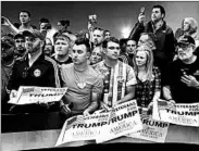  ?? NAM Y. HUH/AP ?? Donald Trump fans line up for autographs at a rally Tuesday in Janesville, Wis., that was the site of an altercatio­n.