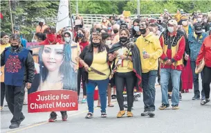  ?? STEPHEN MACGILLIVR­AY THE CANADIAN PRESS ?? Participan­ts take part in a healing walk from the Madawaska Malaseet reserve to Edmundston, N.B., to honour Chantel Moore, a 26-year-old Indigenous woman who was fatally shot by police on June 4.