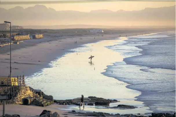  ?? Picture: © Alan van Gysen ?? GOOD MORNING A rare sighting of a lone surfer entering the sunrise line-up at the Berg, the beach where surfing in SA began in 1919 thanks to two visiting US Marines.