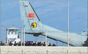  ?? AP PHOTO ?? Turkish soldiers carry the coffin of a Russian pilot, whose plane was shot down by Turkish jets, into an air force transport plane at the Hatay airport on Sunday.