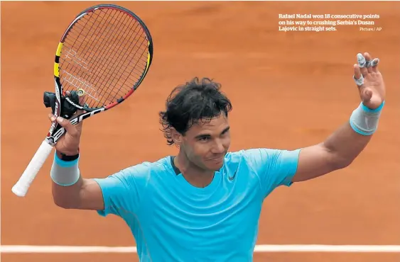  ?? Picture / AP ?? Rafael Nadal won 18 consecutiv­e points on his way to crushing Serbia's Dusan Lajovic in straight sets.