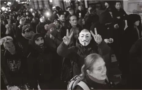  ?? Getty ?? The Million Mask March, an annual anti-authoritar­ian demonstrat­ion, drew crowds angry about the latest lockdown