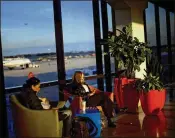  ?? MARK MAKELA / THE NEW YORK TIMES ?? Airlines are now profitable enough to be able to spruce up their airport lounges and waiting areas with amenities, such as this charging station at Philadelph­ia Internatio­nal Airport.