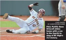  ?? STAFF PHOTO BY CHRISTOPHE­R EVANS ?? FULL PLATE: Dave Driscoll slides home with a run in the fourth inning of BC High’s 3-2 victory.