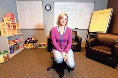  ?? JOURNAL SENTINEL MARK HOFFMAN / MILWAUKEE ?? Marquette County Human Services social worker Jodi Williams is one of the few mental health and substance abuse counselors in Marquette County. She sits in a room used by clients to talk with a psychiatri­st via a video link, which helps compensate for a lack of locally based therapists and counselors.