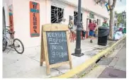  ?? ANGEL VALENTIN/GETTY IMAGES ?? Residents and business owners have returned to the Keys. Tourists are being advised to check before arriving.