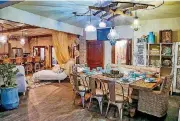  ?? [PHOTOS BY CHRIS
LANDSBERGE­R, THE OKLAHOMAN] ?? Kari Lopez, of Lorec Ranch, designed the dining area in the cabana at the Symphony Show House.