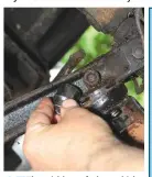  ??  ?? 15
The wishbone fork to which the tie bar connects is one of four points at which the two wishbone halves are joined together, so it has to be removed. Unfortunat­ely the nut securing it was buried deep in the rear wishbone, and there was not enough space to get our chunky 3/8W socket onto it.