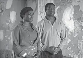  ?? AIDAN MONAGHAN/NETFLIX ?? Wunmi Mosaku, left, as Rial Majur and Sope Dirisu as Bol Majur in a scene from the Netflix film “His House.”